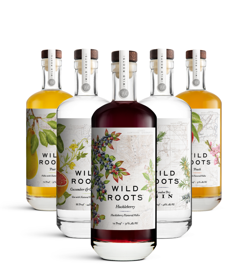 Five bottles of Wild Roots gin and vodka with colorful labels on a white background
