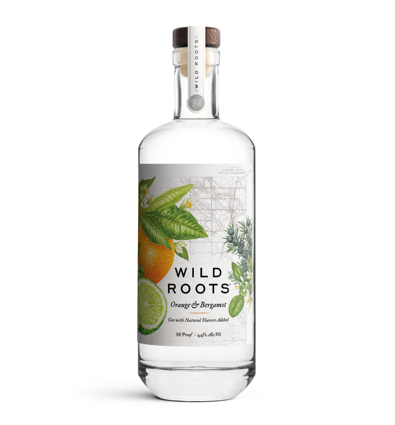 Bottle of Wild Roots Orange & Bergamot gin on a white background
