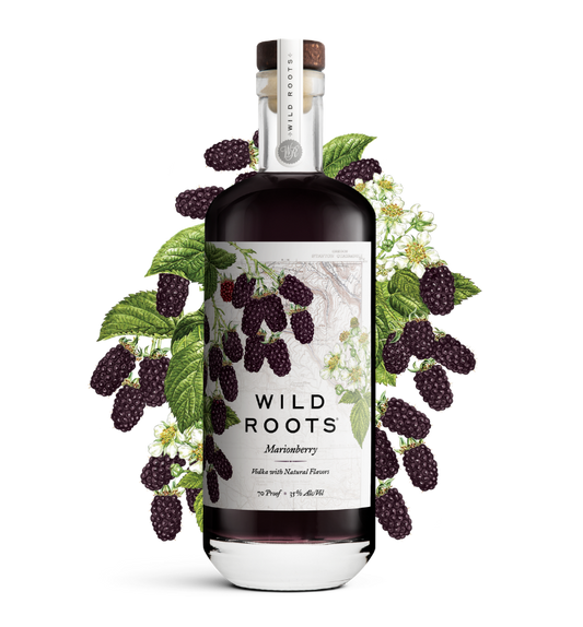 Bottle of Wild Roots Marionberry vodka with marionberries and green leaves on a white background